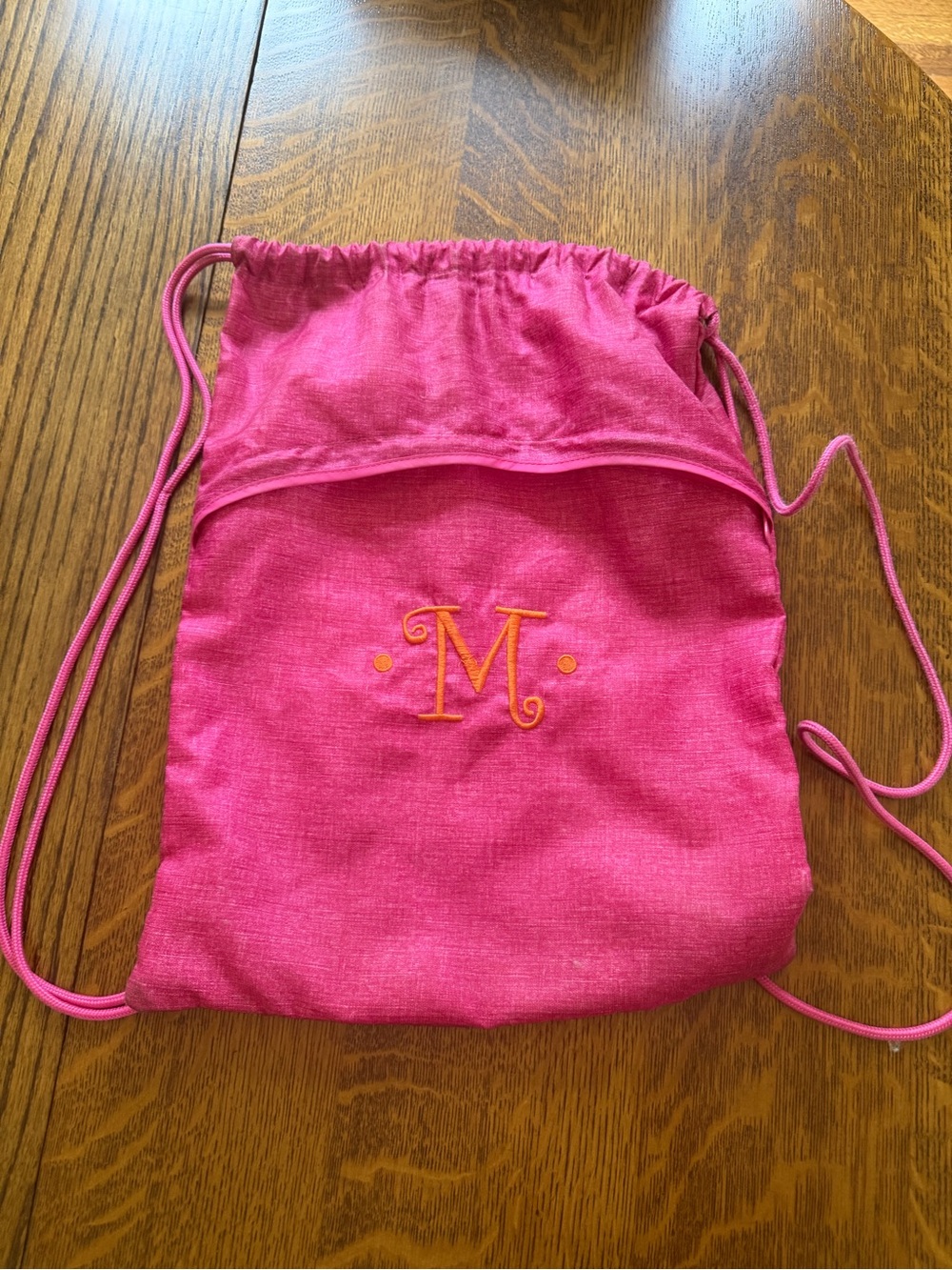 Pink Drawstring Backpack with Orange Monogram